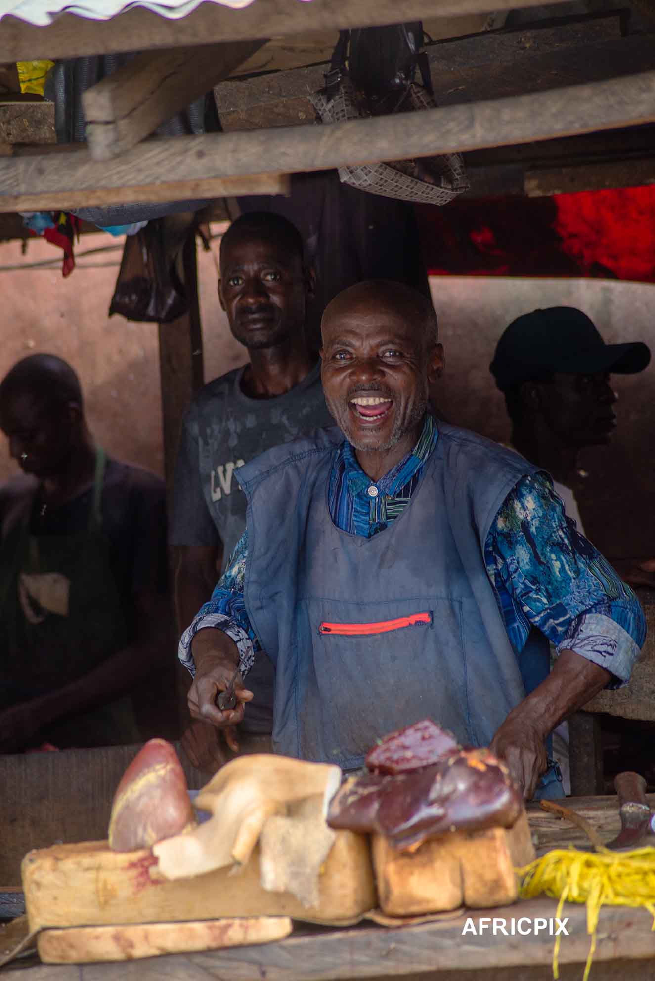 Nigeria Market Man Butcher In Front of Shop