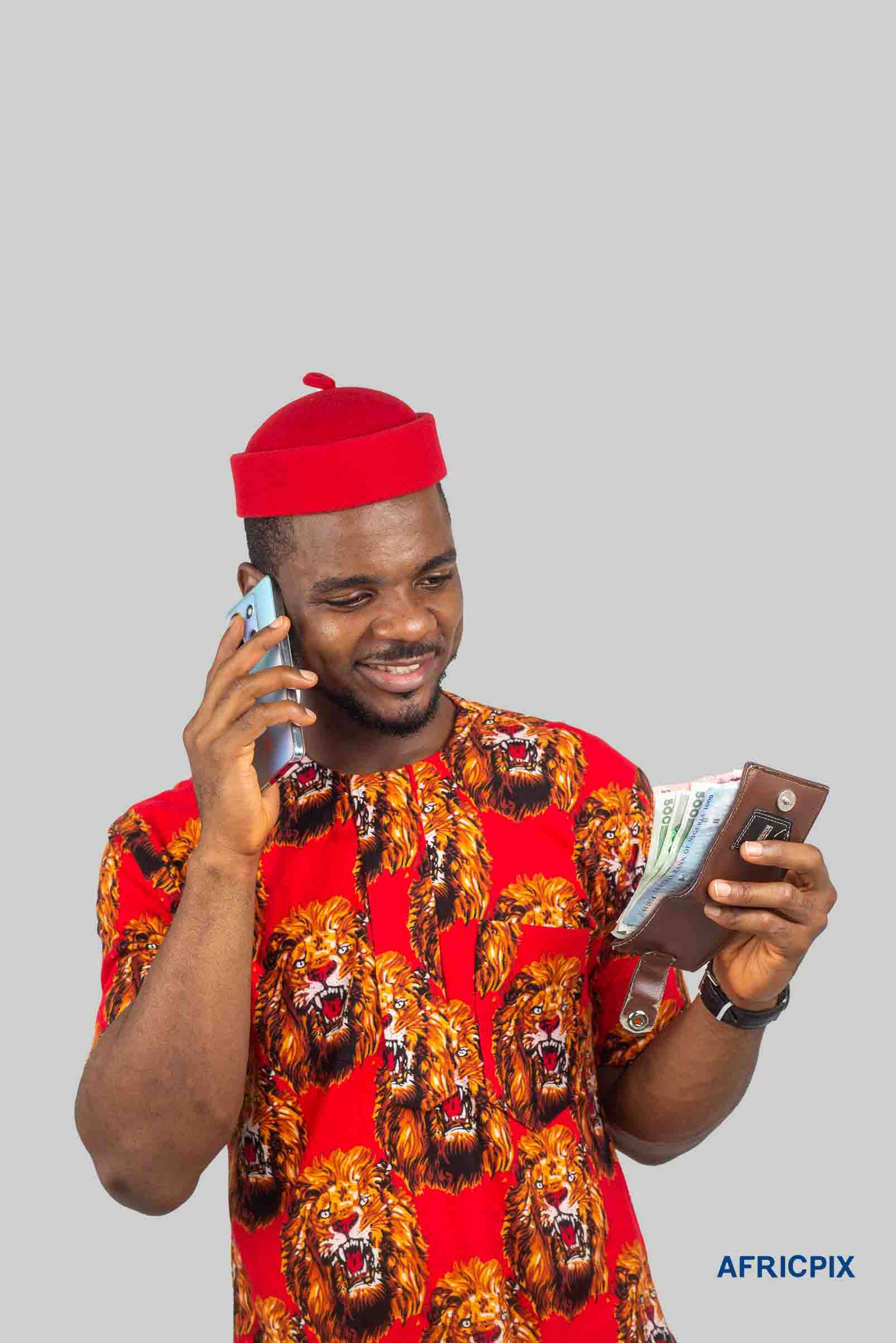 Nigeria Igbo Man Holding Phone and Wallet