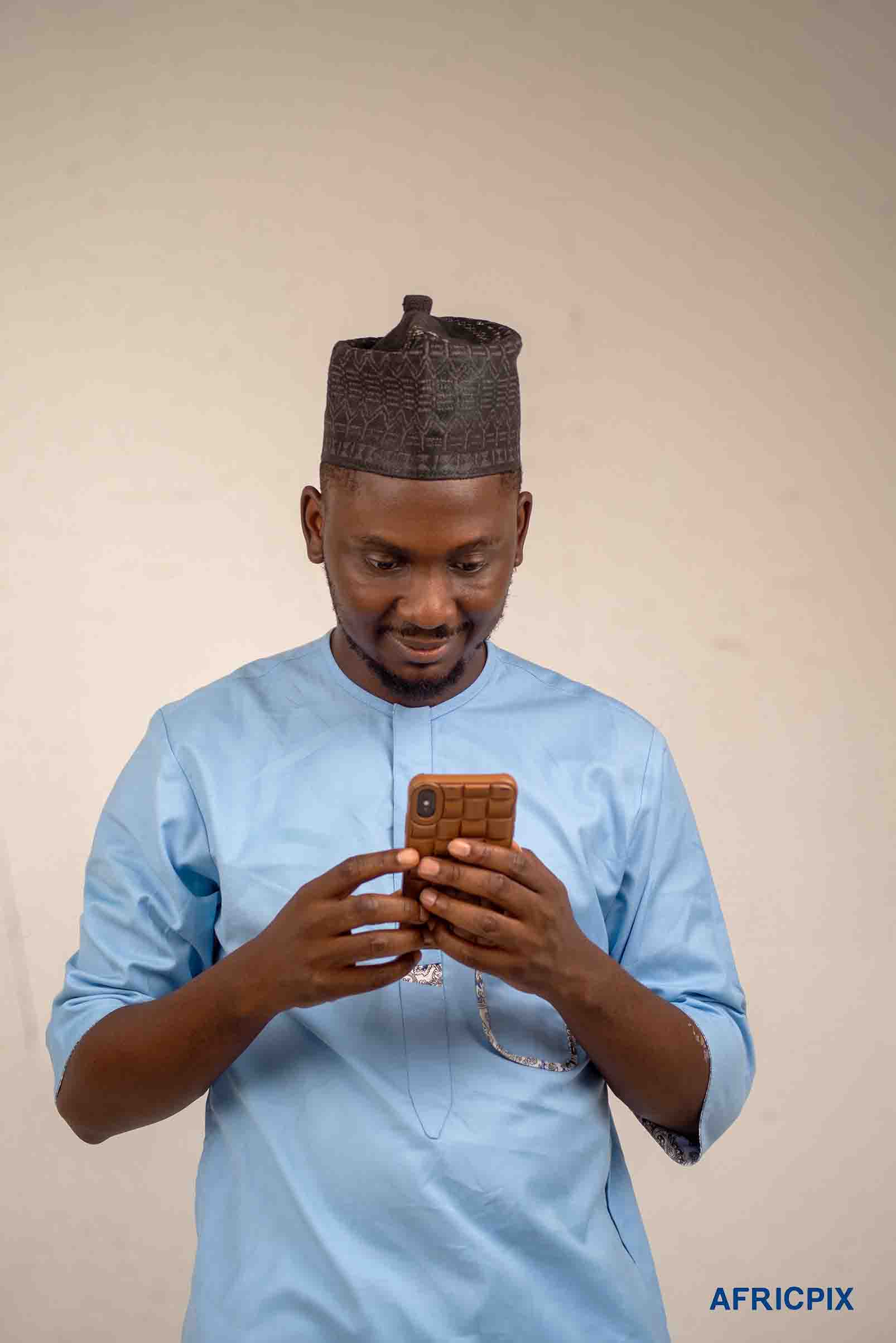 Nigeria Hausa Man Operatinf Phone Looking