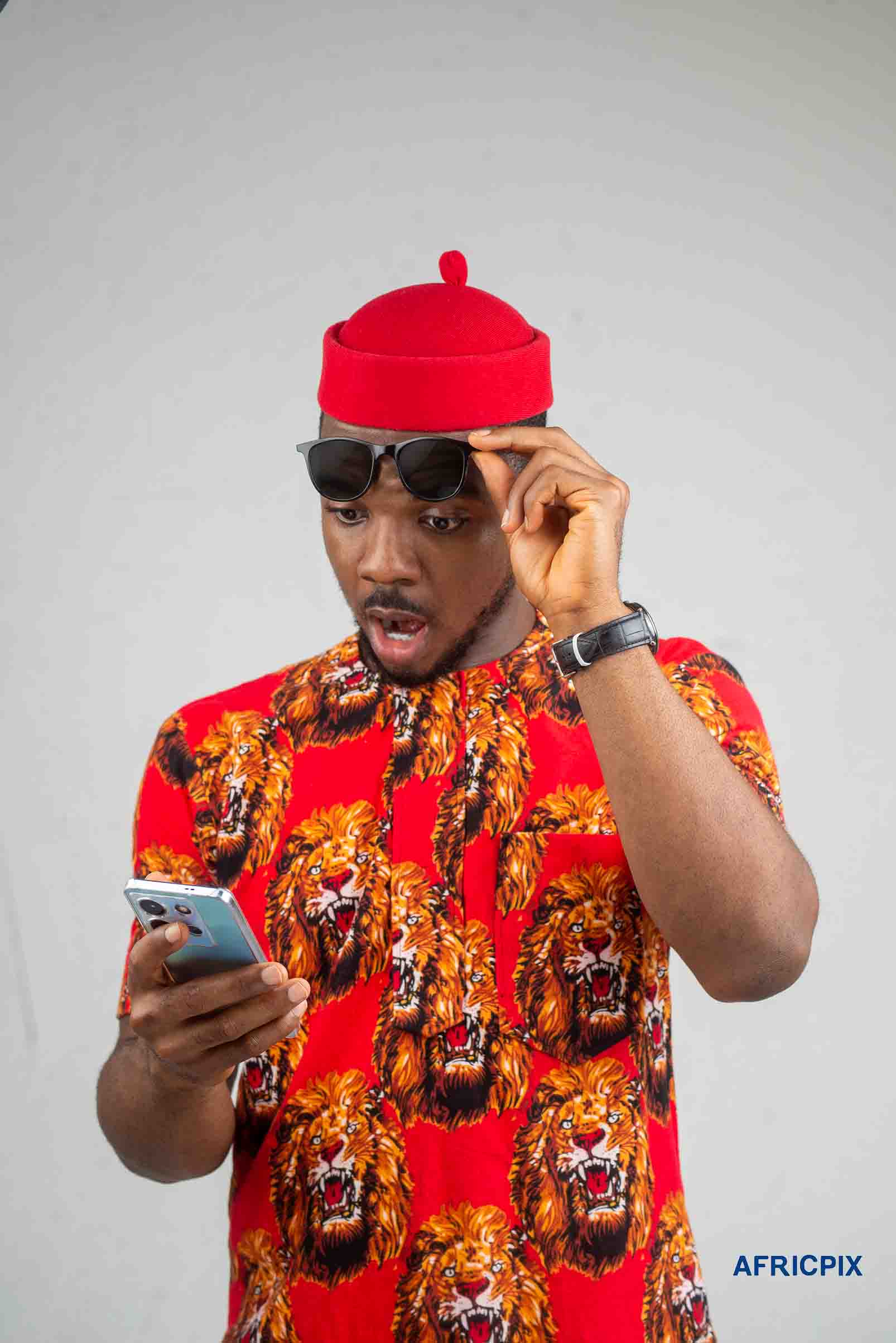 Nigeria Igbo Man Holding Phone Looking Surprise