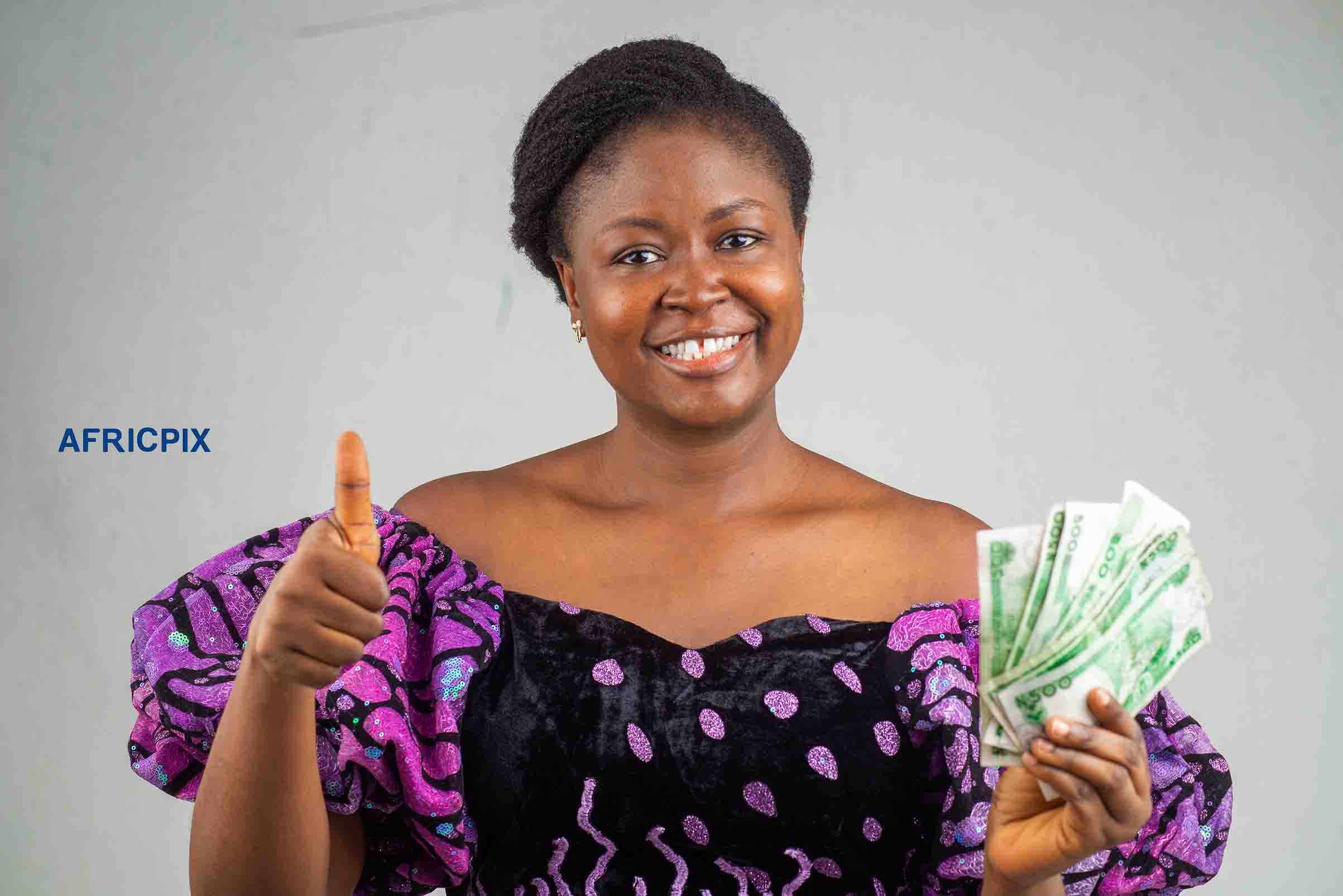 Happy Nigeria Woman Holding Naira Money  Thumb Up