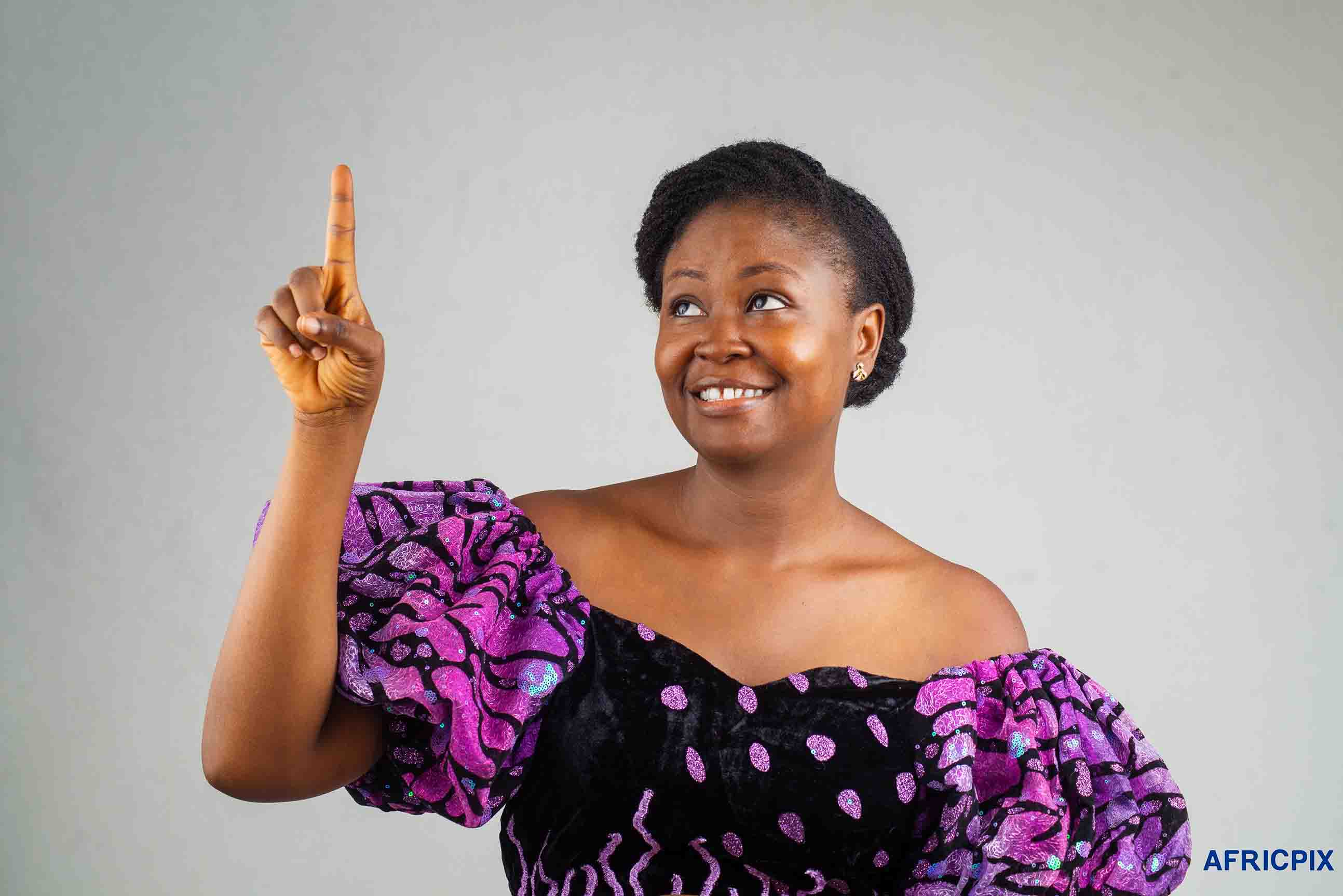Nigeria Woman Pointing UP Wearing Native Attire