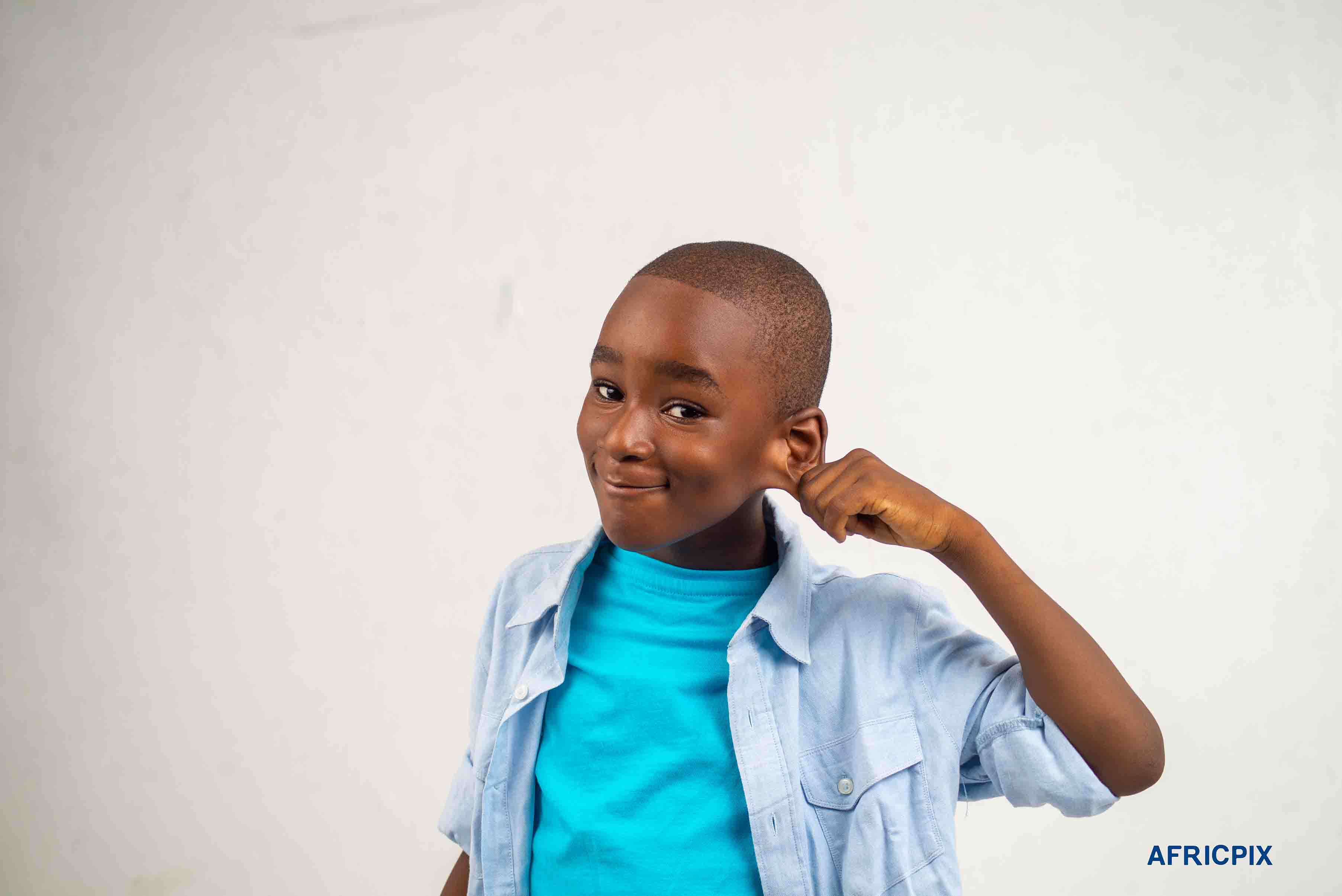 Nigeria Child Boy Holding Ear