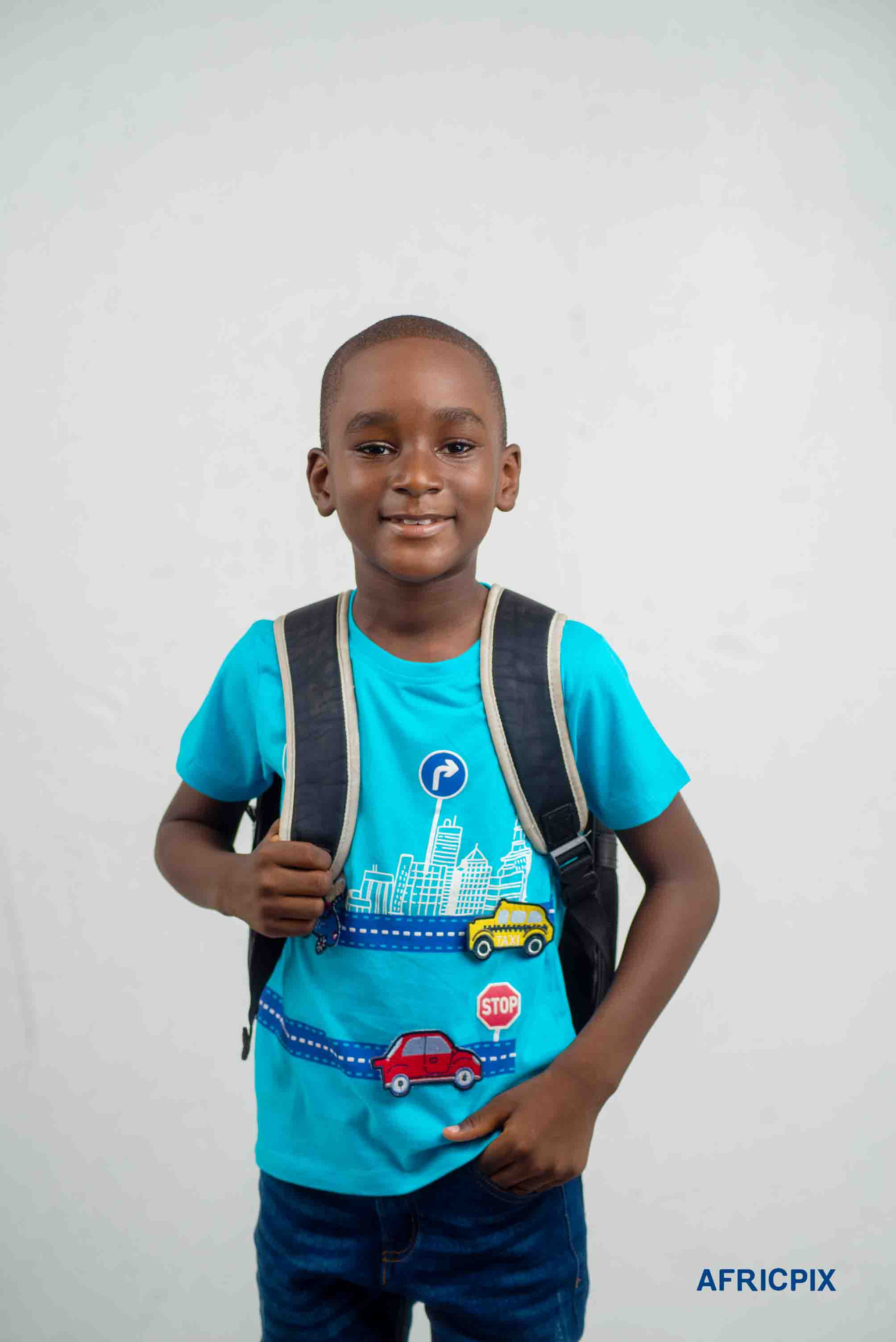 Nigeria Child Boy With School Bag_and in Pocket