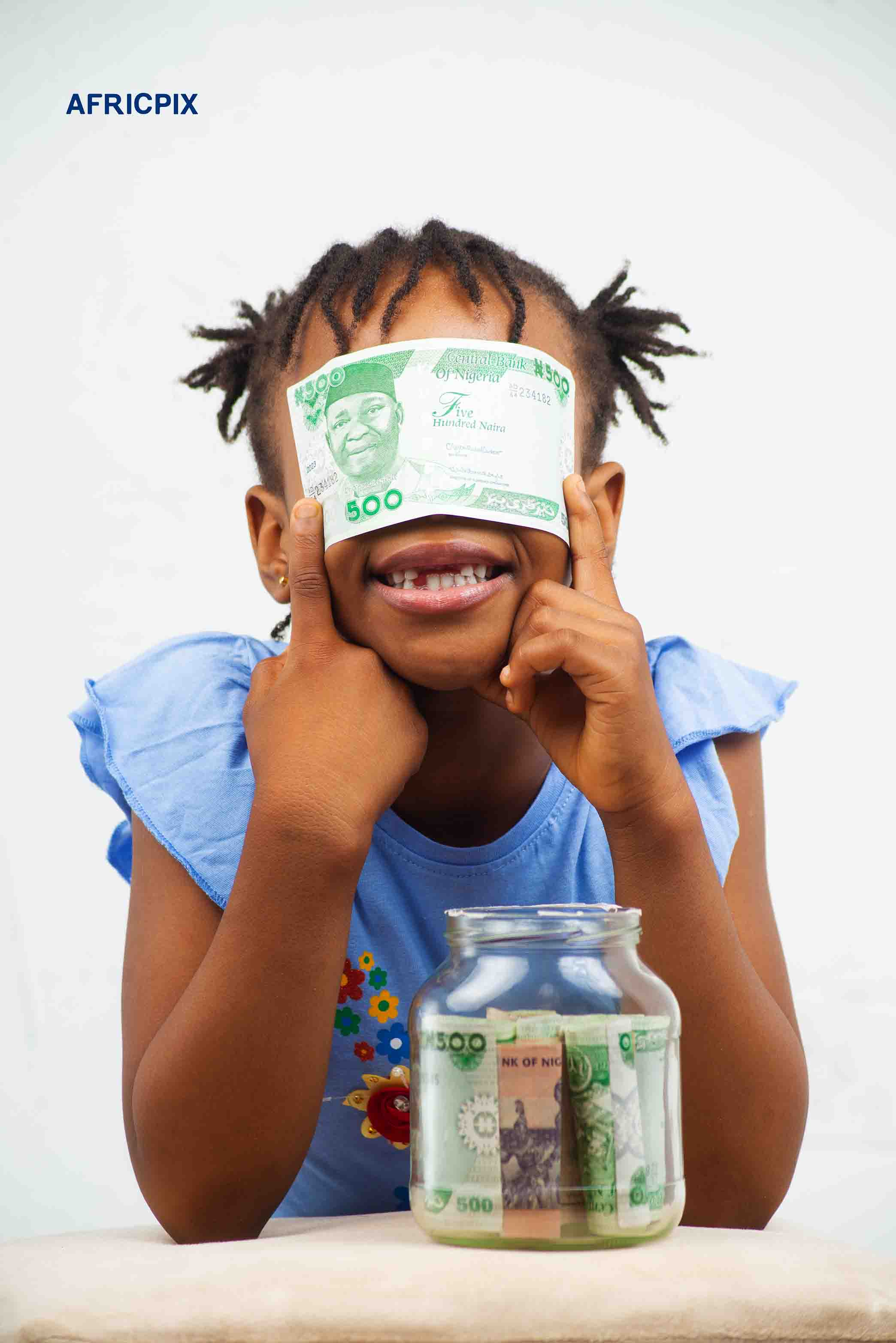 Nigeria Child Girl Holding Naira Money on Face