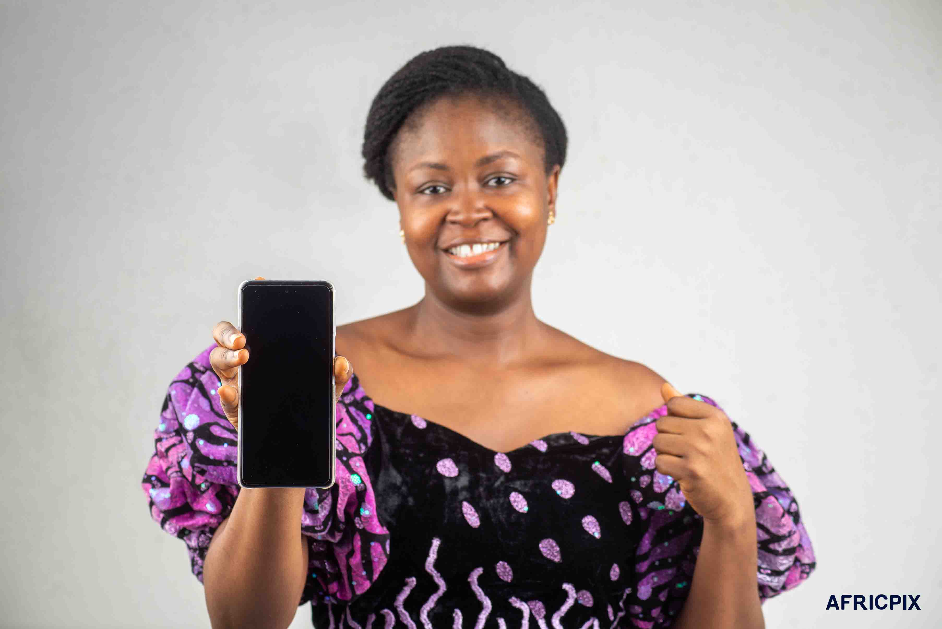 Nigerian Woman Pointing Phone At Camera